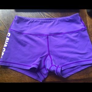 Purple savage barbell shorts.